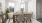 a dining room table with white chairs