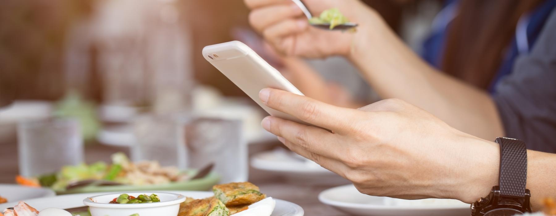 a couple of people eating at a restaurant