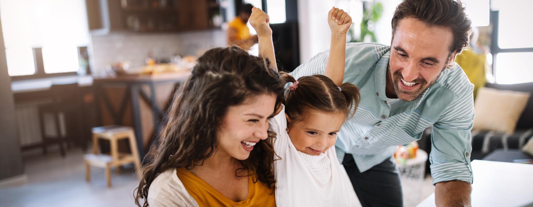 a family working on a laptop