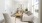 a living room with white furniture